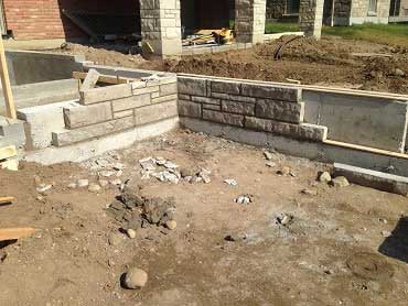 Build photo of the retaining wall and patio