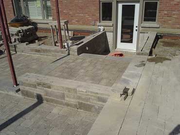 Build photo of the patio and natural stone retaining wall